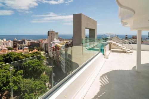a view of the city from the balcony of a house at INNSiDE by Meliá Tenerife Santa Cruz in Santa Cruz de Tenerife