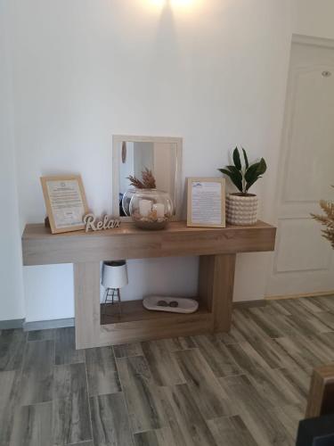 a wooden table in a living room with wood floors at Vila MerSea in Mamaia Sat/Năvodari