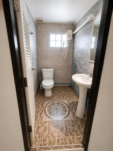 a bathroom with a toilet and a sink at SET INN restaurant & bar 1 & 2 in Kata Beach