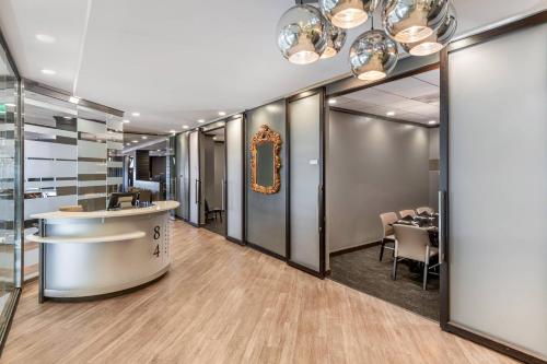 a salon with a reception counter and a table at Radisson Blu Fargo in Fargo