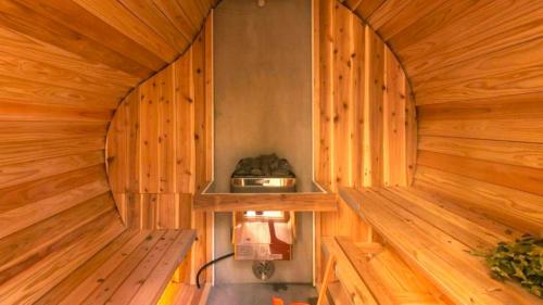 an inside of a sauna with a wooden wall at rinne 2nd living Sauna Villa Nasu in Nasu