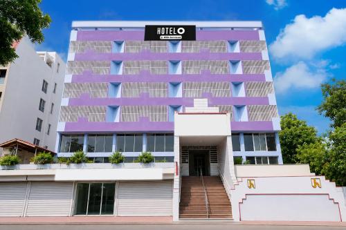 a building with a sign on top of it at Hotel O Bhavnagar Bus Terminal Formerly Jubliee in Bhavnagar