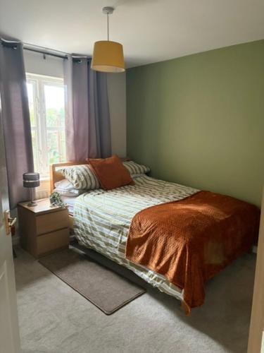 a bedroom with a bed and a window at Sansome House in Worcester