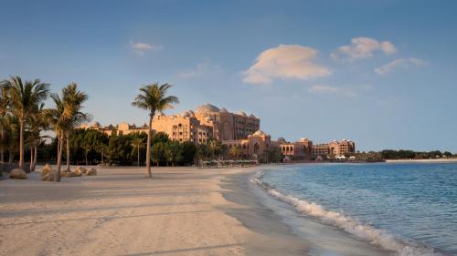 a view of a beach with a resort in the background at Emirates Palace Mandarin Oriental, Abu Dhabi in Abu Dhabi