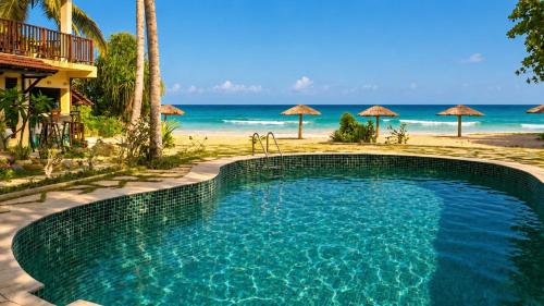 a swimming pool next to a beach with umbrellas at Samadhi by the Venus Project in Ranna
