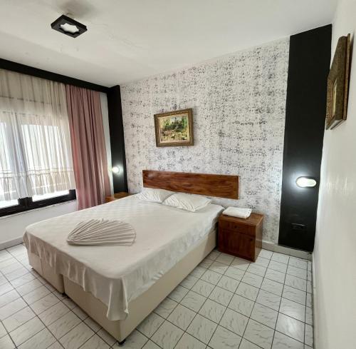 a bedroom with a bed in a room at Delphin Apart Hotel in Side