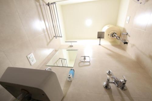 a bathroom with a sink and a mirror at Blue Beds Hostel in Jaipur