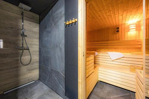 a bathroom with a sauna with a shower at Luxury TABOO Villa & Spa in Medulin for 8 people with heated pool & wellness area in Medulin