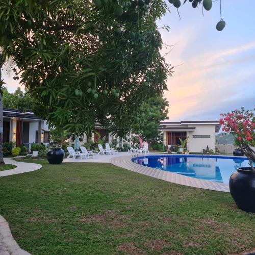 a resort with a swimming pool in a yard at Strand 