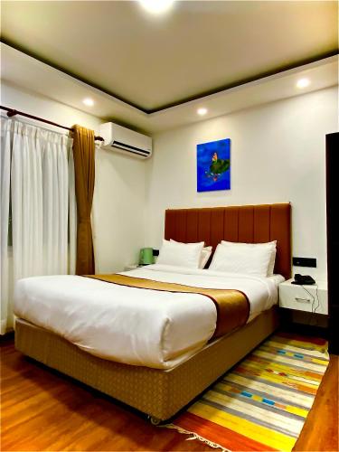a bedroom with a large bed in a room at Hotel Heranya in Kathmandu