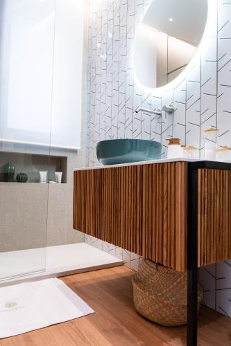 a bathroom with a sink and a mirror at DELL'EDERA Luxury Home in Polignano a Mare
