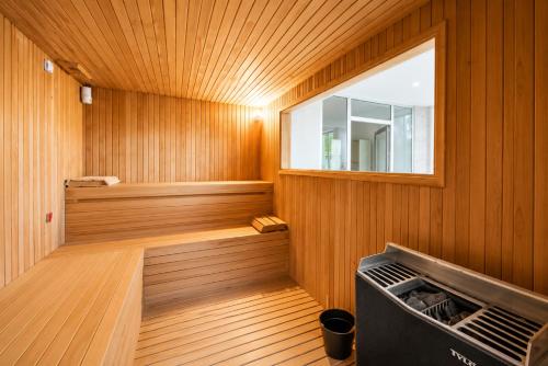 a sauna with a window in a wooden wall at Tripolis Hotel in Pamukkale