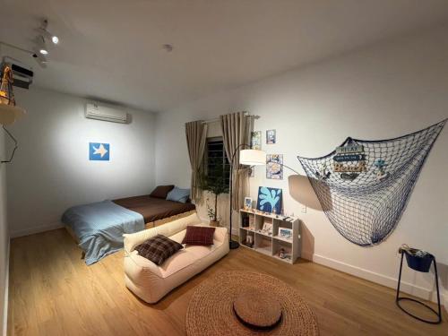 a bedroom with a bed and a hammock in it at 12 Homestay & Hotel in Lạng Sơn