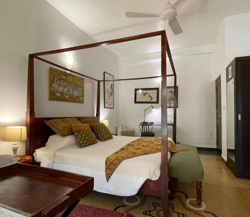 a bedroom with a canopy bed in a room at Zaza Stay in New Delhi