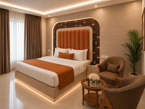 a hotel room with a bed and a chair at Hotel Cloud Suites Delhi Airport in New Delhi