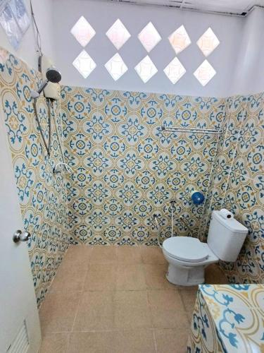 a bathroom with a toilet in a room at Magic View Apartments Koh Tao in Ko Tao