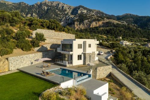 an aerial view of a house with a swimming pool at Sofia's Estates - Villa Athena -Adults Only- in Kos