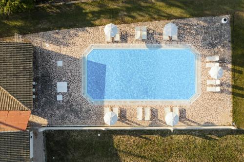 an overhead view of a swimming pool on a house at Mariposa Apartments in Kavos