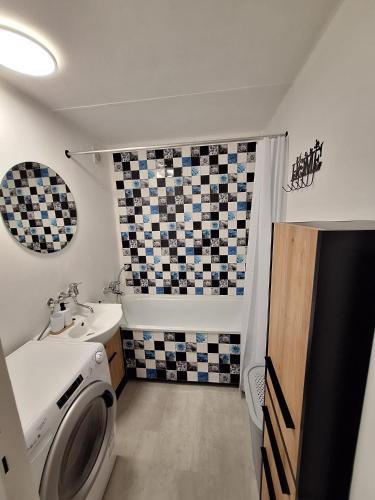 a bathroom with a toilet and a sink at Green Studio Martin in Martin