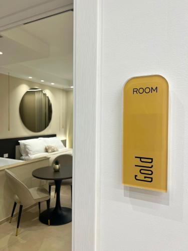 a door to a room with a table and a bed at Manoli Luxury Rooms in Vieste