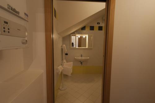 a bathroom with a sink and a toilet in a room at Locanda Veneta in Vicenza