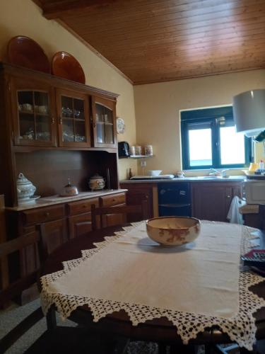 a kitchen with a table with a bowl on it at Casinha Meixedo in Bragança
