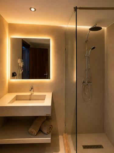 a bathroom with a sink and a shower at HOTEL KAISER in Sousse
