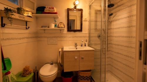 a bathroom with a shower and a sink and a toilet at Dimora dei Ciri in Ferrandina