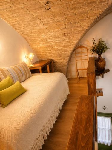 a bedroom with a bed and a wooden floor at Dimora dei Ciri in Ferrandina