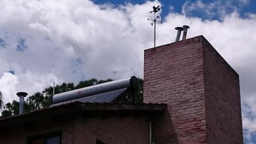 a baseball bat on top of a brick building at Cabañas 57 in Villa Carlos Paz
