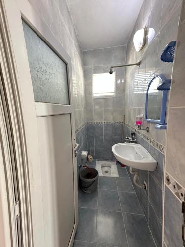a small bathroom with a sink and a toilet at Yalçın Pansiyon in Silifke