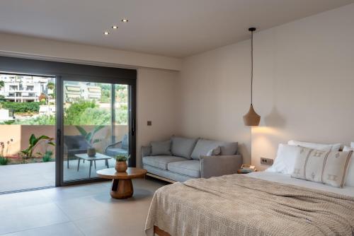 a bedroom with a bed and a couch at Villa Terra Rossa in Daratso