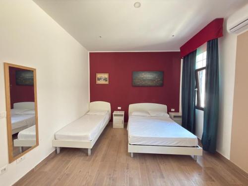 a hospital room with two beds and a mirror at Dream holiday in Mestre