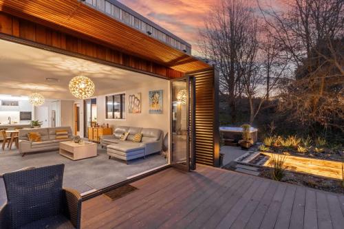a large patio with a couch and a table at 5 o'clock somewhere in Masterton