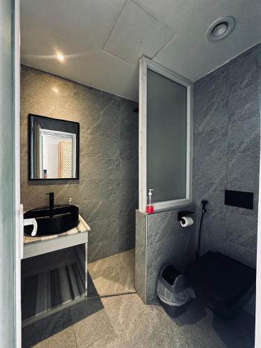a bathroom with a sink and a toilet and a mirror at Blue Beach Club in Dahab