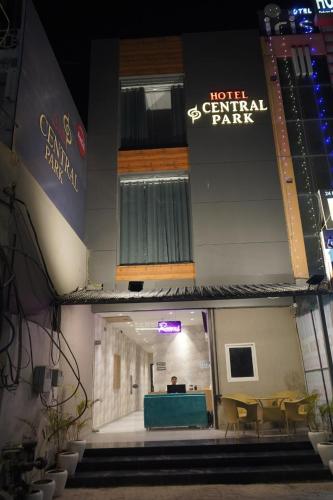 a front view of a building with a table and chairs at HOTEL CENTRAL PARK in Bathinda