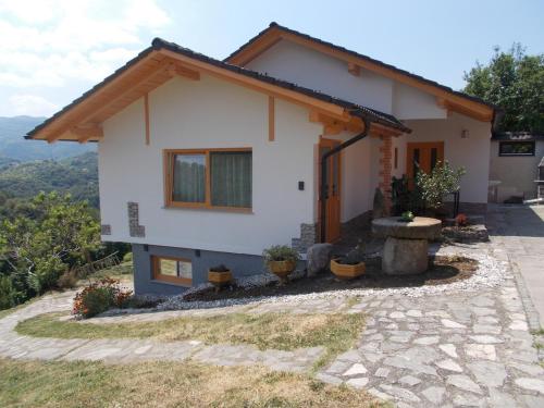 a house on the side of a mountain at Prima Apartment in Podbočje