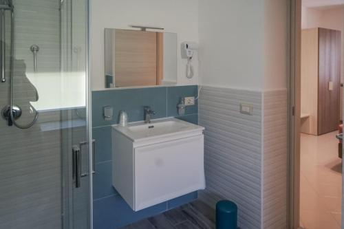 a bathroom with a sink and a shower at Nonna Carmela Holiday House in San Lazzaro Agerola