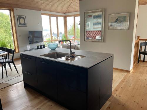 a kitchen with a sink and a counter at Tromsø Panorama in Tromsø