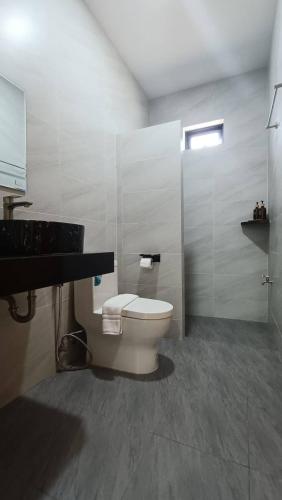 a bathroom with a toilet and a sink at Green Mountain View villas Koh samui in Plai Laem