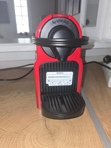 a red and black blender sitting on a table at Gemareia Lodge in Lefkada