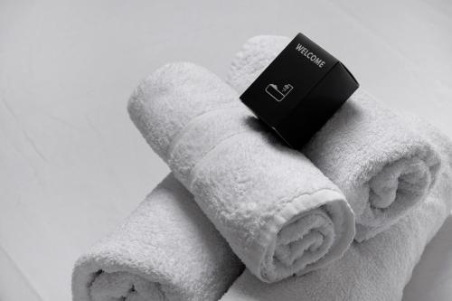 a white towel with a box on top of it at Studio Centre Cannes, Rue d’Antibes in Cannes