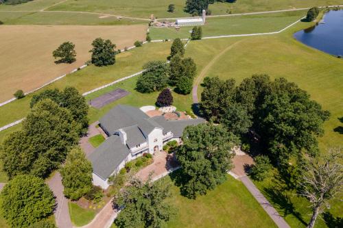 an overhead view of an estate with a building and trees at The Herrington by Railey Vacations in Oakland