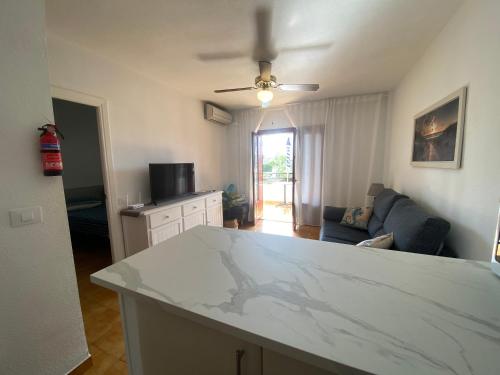 a kitchen and living room with a white counter top at Apartment with private balcony in San Javier