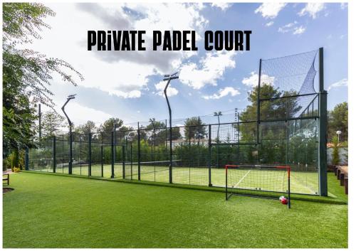 a batting cage with a soccer ball on a field at Carrasca 8 paddle & pool in Alcoy