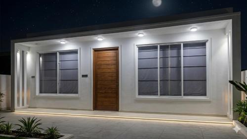a house with two windows and a door at The Harmony Mount Lavinia in Dehiwala
