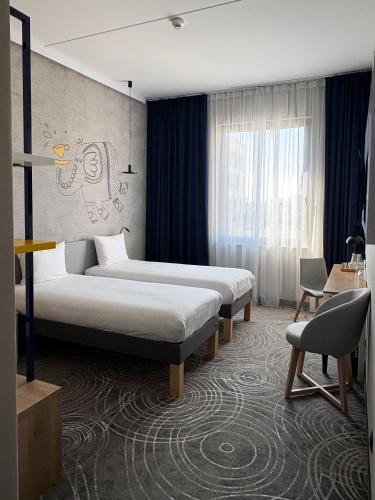 a hotel room with two beds in a room at Cobalt36 in Bolesławiec