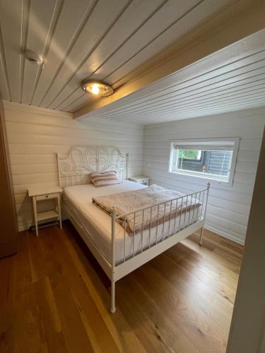 a bedroom with a bed in a room at The Hidden Gem in Ålesund