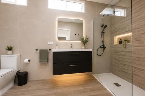 a bathroom with a sink and a mirror at Sea View Colony Club in Puerto del Carmen