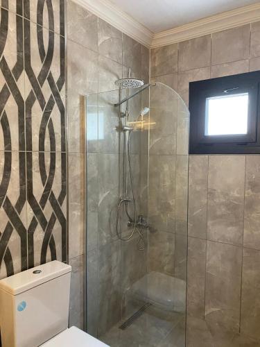 a bathroom with a shower with a toilet at MAİ Sarıgerme in Sarigerme